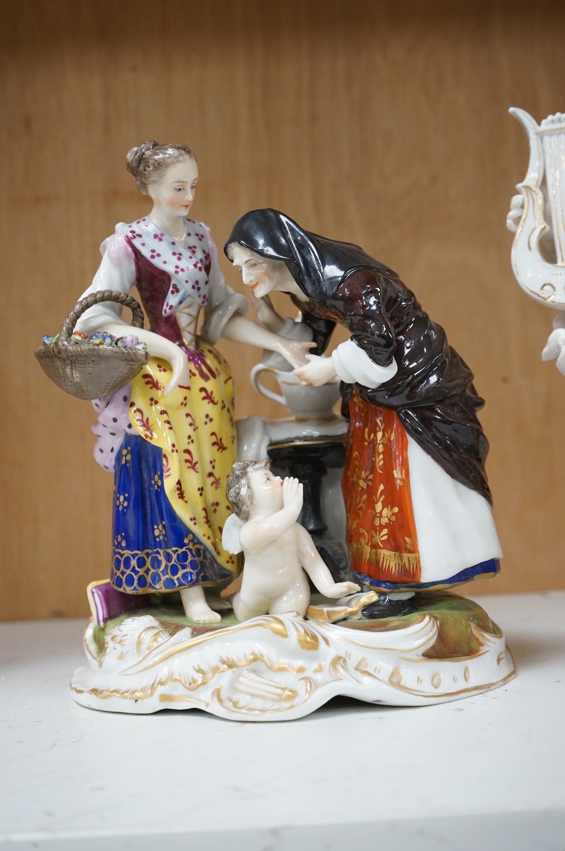 A Ludwigburg style group and a Volkstedt figure of a lyre player, 20cm high